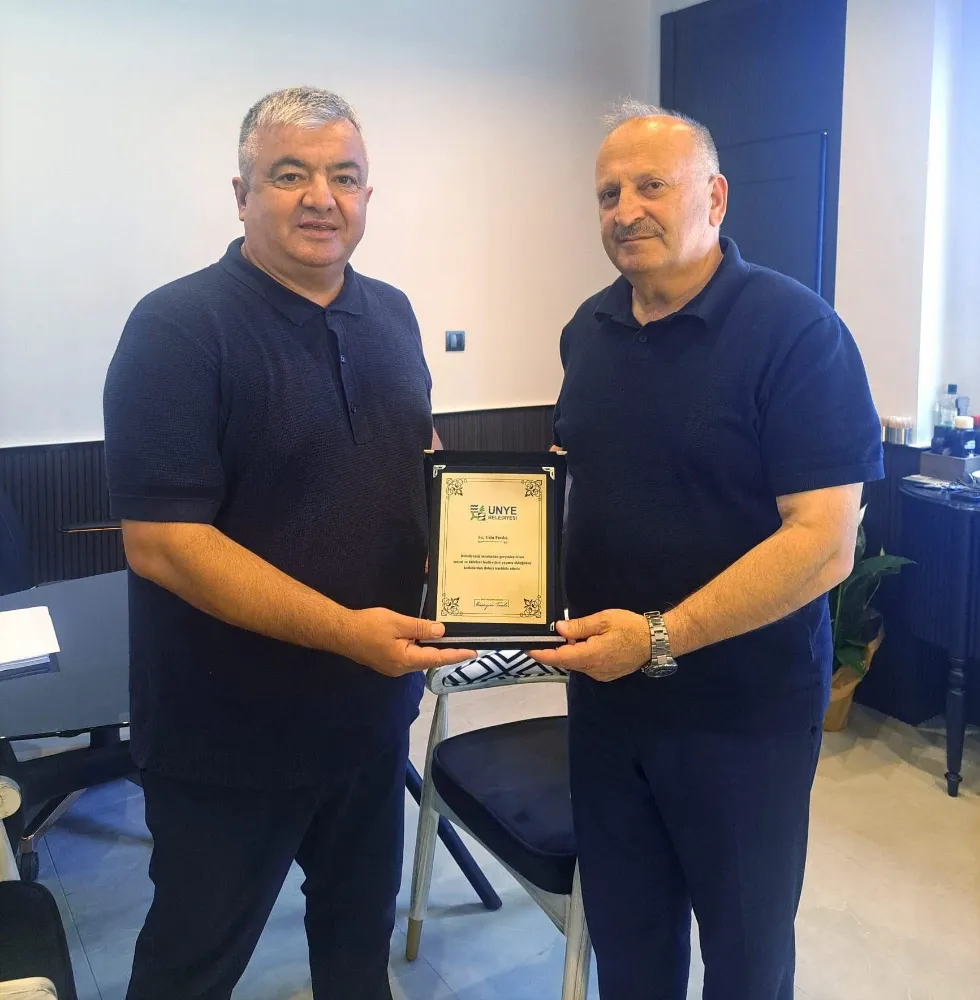 BAŞKAN TAVLI’DAN MUSTAFA USLU’YA TEŞEKKÜR PLAKETİ